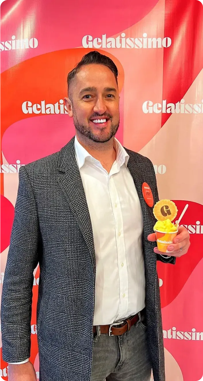 Mathew Butler smiling with Gelatissimo ice cream